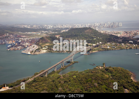 Aerial view of the Bridge of the Americas at the Pacific entrance to the Panama Canal with Panama City in the background, Panama Stock Photo