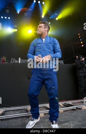 International singing sensation Robbie Williams joined rap star Dizzy Rascal on stage at the Radio1's One Big Weekend in Derry, Londonderry. Stock Photo