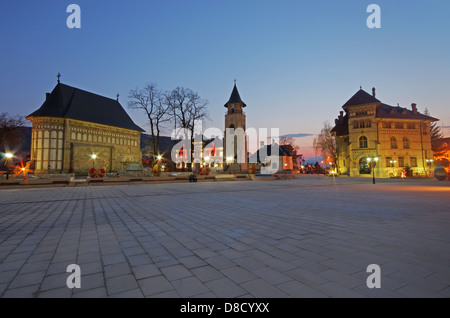 City square in Piatra Neamt: Royal Court with Stephen the Great Church and Tower Stock Photo