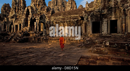 Chasing the magical light at Temple Bayon in Cambodia, which is part of Angkor Wat. Stock Photo