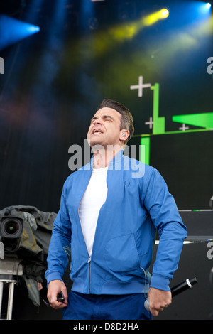 International singing sensation Robbie Williams joined rap star Dizzy Rascal on stage at the Radio1's One Big Weekend in Derry, Londonderry. Stock Photo