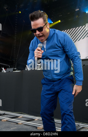 International singing sensation Robbie Williams joined rap star Dizzy Rascal on stage at the Radio1's One Big Weekend in Derry, Londonderry. Stock Photo