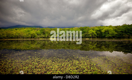 Stormy Overcast Sky at Shiretoko Five Lakes with clear reflection Stock Photo