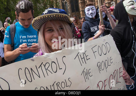 2013-05-25 Westminster, London. A young activist with her banner protests against seed giant Monsanto and genetic modification in London. Stock Photo