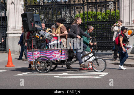 2013-05-25 Westminster, London. A band towed behind a bicycle en-route to a demonstration outside Parliament, against crop seed giant Monsanto. Stock Photo