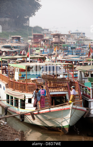 Ships docked on Ayeyarwaddy River waterfront near Mandalay, Myanmar Stock Photo