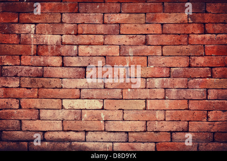 Weathered stained vintage red brick wall background Stock Photo