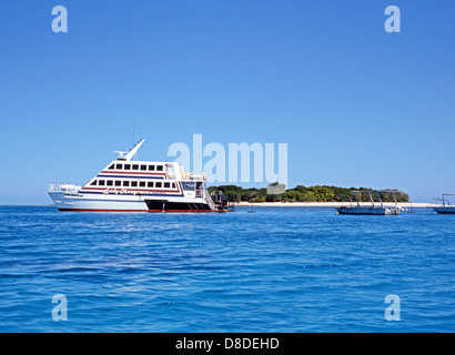 Tourist boats anchored off Lady Musgrave Island, Capricorn Cays National Park, Great Barrier reef, Queensland, Australia. Stock Photo