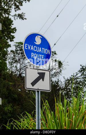 An evacuation route sign next to a road in the US Stock Photo