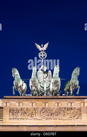 Brandenburger Tor Brandenburg Gate Quadriga statues of four horses and chariot on top of gate at twilight Mitte Berlin Germany Stock Photo