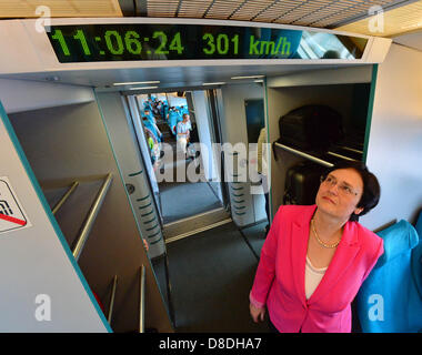 Premier of Thuringia Christine Lieberknecht looks at the speed on board a Transrapid from the airport to Longyang Road Station in Shanghai, China, 25 May 2013. The premier is visiting China with a large delegation to discuss and expand the business and academic relationship with China until 31 May. Photo: MARTIN SCHUTT Stock Photo