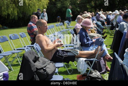 Horsham Sussex UK. 26 May 2013 - Spectators sunbathe as the weather hots up as Sussex Sharks take on Kent Spitfires in their YB40 cricket match at Horsham today Photograph taken by Simon Dack/Alamy Live News Stock Photo