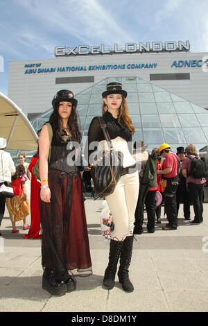 London, UK. 26th May, 2013. Thousands of people attended the MCM London Comic con on Sunday 26th May. Pictured:Two Comic fans dressed in Steampunk costume poses for photos at the Excel London. Credit David Mbiyu/Alamy Live News Stock Photo