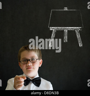 Education needs you thinking boy dressed up as business man with learn art chalk easel on blackboard background Stock Photo