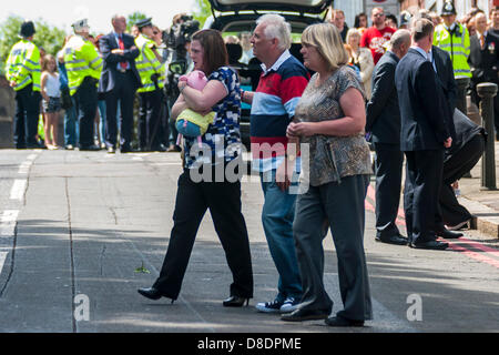 London, UK. 26th May, 2013. Members of slain soldier Drummer Lee Rigby visit the Woolwich site of his murder to see the many thousands of floral tibutes. Credit: Paul Davey/Alamy Live News Stock Photo