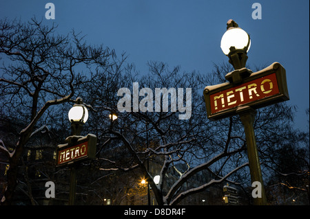 Snow covered Dervaux, Art Déco Paris Metro sign outside Metro Station, Paris. Stock Photo