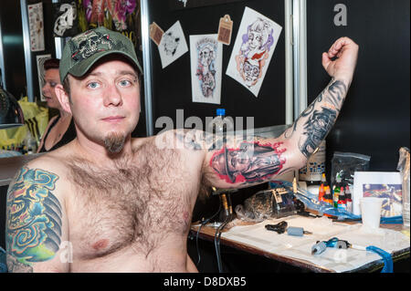 London, UK, 26th May 2013. Rafal Wolczyk, a driver from Poland shows his new tattoo of Al Capone. Credit: /Alamy Live News Stock Photo