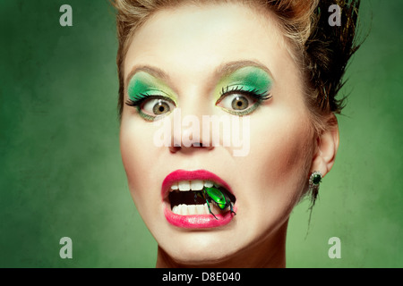 Beautiful woman with a beetle Stock Photo