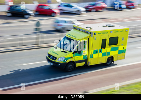 NHS Ambulance on emergency call. Speeding Stock Photo