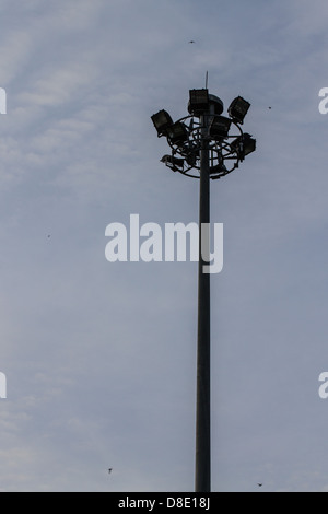 triple layer floodlight that against blue sky Stock Photo