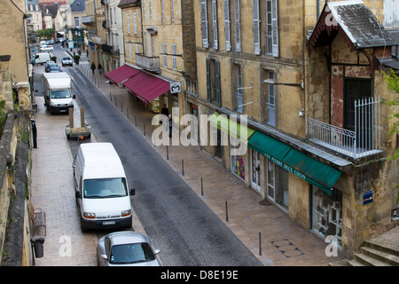 Sandstone building and shops on Rue de la Republique, the main street in Sarlat, France Stock Photo
