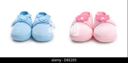 Closeup of cute pink and blue baby boy and girl shoes isolated on white background Stock Photo