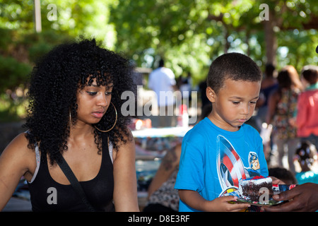 Four year-old birthday boy getting birthday cake, Finley Park, California, USA, North America Stock Photo