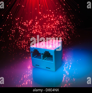 network cables and hub closeup with fiber optical background Stock Photo