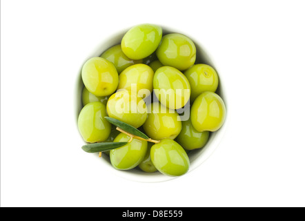 Green olives on white background seen from above. Stock Photo