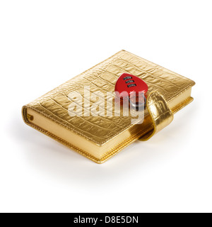 Luxury golden diary with heart shape padlock on white background Stock Photo