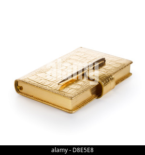 Luxury golden leather notebook with pen on white background Stock Photo