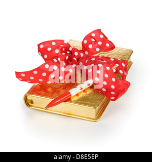 Luxury gift diary with red ribbon and pen on white background Stock Photo