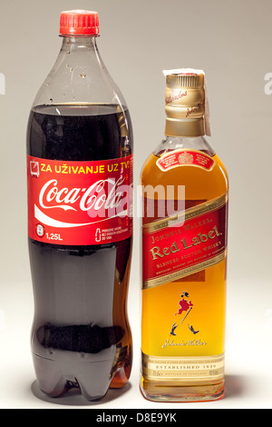 Cacak, Serbia - May 20, 2013: Coca Cola and Johnnie Walker Whiskey, studio isolated. Stock Photo