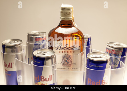 Cacak, Serbia - May 20, 2013: Six Red Bull Cans and Ballantine's Whiskey, studio isolated. Stock Photo