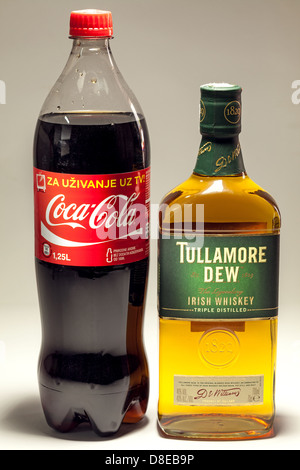 Cacak, Serbia - May 20, 2013: Coca Cola and Tullamore DEW Whiskey, studio isolated. Stock Photo