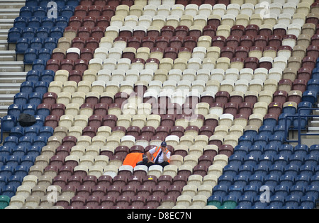 A lone steward in the empty Alan Kelly Stand at Deepdale stadium, home of Preston North End Football Club Stock Photo