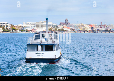 Small passenger ferry leaving the community of Salt Kettle, heading towards the city of Hamilton, Bermuda. Stock Photo