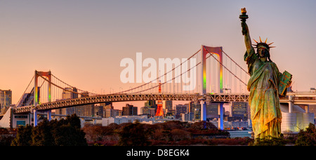 Statue of Liberty, Rainbow Bridge, and Tokyo Tower as seen from Odaiba in Tokyo, Japan. Stock Photo