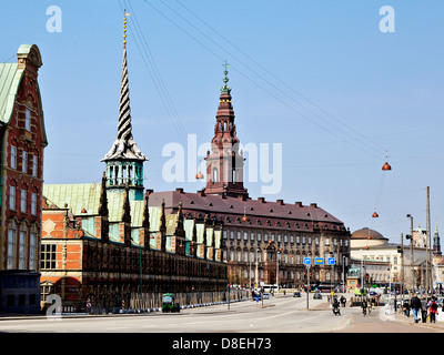 Børsen, the farmer Stock Exchange, in central Copenhagen was built by Christian IV in 1619–1640 and is the oldest stock exchange in Denmark. The building is 127 metres long and the Dragon Spire shaped as the tails of four dragons twined together, has a height of 56 metres. Stock Photo