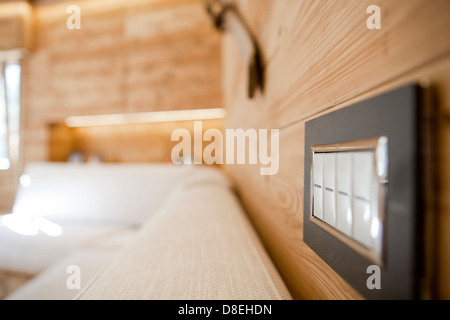 Electrical plug in on wooden wall Stock Photo