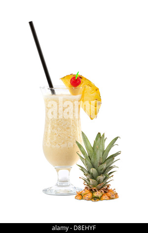 Pina Colada cocktail with pineapple pieces, cocktail cherry and straw isolated on white background Stock Photo