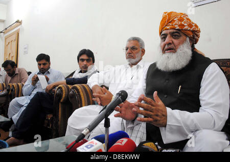 Jamiat Ulema-e-Islam Chief, Mulana Fazl-ur-Rehman addresses to media persons during press conference at JUI Secretariat in Peshawar on Monday, May 27, 2013. Stock Photo