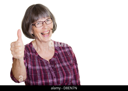 Happy smiling woman in glasses, pensioner showing thumbs up Stock Photo