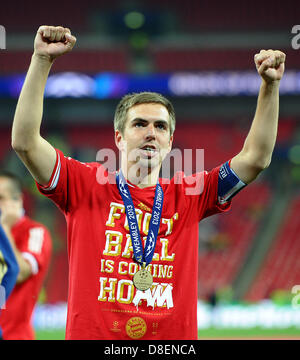 Munich's Philipp Lahm celebrates after the Champions League final between German soccer clubs Borussia Dortmund (BVB)and Bayern Munich at Wembley Stadium in London, United Kingdom, 25 May 2013. Photo: Revierfoto Stock Photo