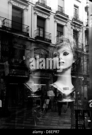 Wig shop in Madrid with reflections Stock Photo