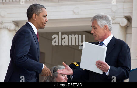 United States President Barack Obama greets U.S. Secretary of Defense Charles 'Chuck' Hagel before speaking during Memorial Day activities at Arlington National Cemetery in Washington on Monday, May 27, 2013. .Credit: Joshua Roberts / Pool via CNP Stock Photo