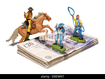 Money being guarded by cowboys Stock Photo