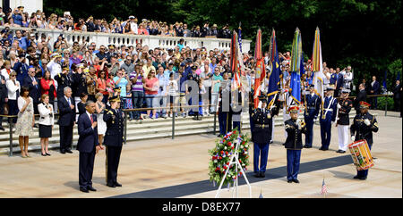 US President Barack Obama stands at attention during the playing of Taps at the Memorial Day ceremony at the Tomb of the Unknown Soldier May 27, 2013 at Arlington National Cemetery, VA. Stock Photo