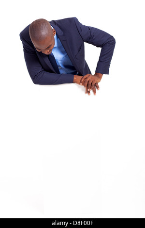 african american business man looking down at empty banner Stock Photo