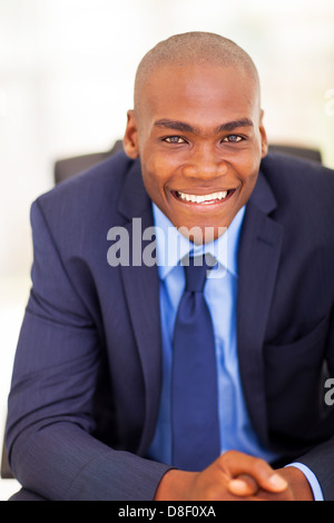 handsome black businessman sitting on office chair Stock Photo